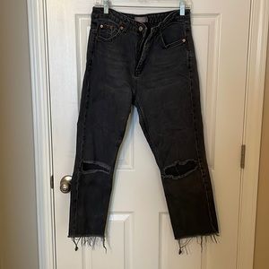 Frayed black jeans